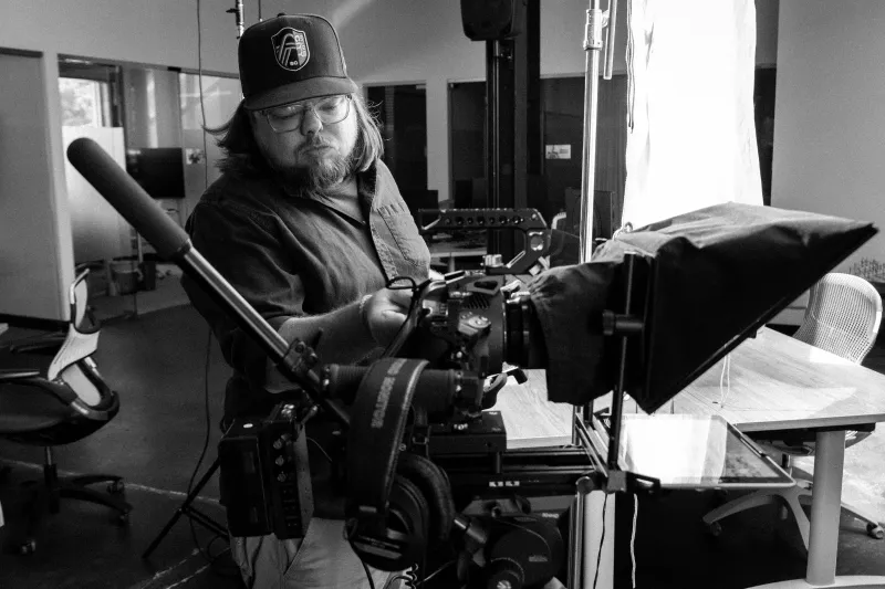 Filming a subject on a teleprompter-equipped camera